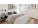 Bedroom featuring neutral decor, plush bedding, and eye-catching wall art at 4992 Trails Edge Ln, Castle Rock, CO 80104