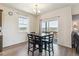 Bright dining area with a table, chairs, and a sliding glass door leading to the backyard at 4992 Trails Edge Ln, Castle Rock, CO 80104