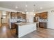 Modern kitchen with granite countertops, stainless steel appliances, and a large center island at 4992 Trails Edge Ln, Castle Rock, CO 80104