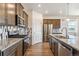 Beautiful kitchen featuring stainless steel appliances, granite countertops, and sleek wooden cabinets at 4992 Trails Edge Ln, Castle Rock, CO 80104