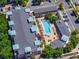 Aerial view of apartment buildings featuring a beautiful pool and surrounding landscaping at 4100 Albion St # 612, Denver, CO 80216