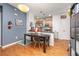 Cozy dining area next to kitchen featuring modern lighting and stylish decor at 4100 Albion St # 612, Denver, CO 80216