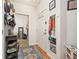 Inviting entryway with a shoe rack, coat rack and a vibrant rug at 4100 Albion St # 612, Denver, CO 80216