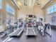 Bright community gym with treadmills, elliptical machines, and ample natural light at 4100 Albion St # 612, Denver, CO 80216