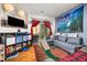 Cozy living room with a large window, plush sofa, and a television at 4100 Albion St # 612, Denver, CO 80216