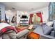 Inviting living room with a cozy seating area, modern lighting, and access to a balcony at 4100 Albion St # 612, Denver, CO 80216