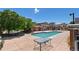 Beautiful community swimming pool surrounded by a large sun deck and mature trees at 4100 Albion St # 612, Denver, CO 80216