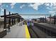 Modern train station with covered waiting areas and a train arriving on the tracks at 4100 Albion St # 612, Denver, CO 80216