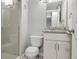 Bathroom featuring tiled shower, toilet, and vanity with granite countertops at 6425 Nassau Ct, Highlands Ranch, CO 80130
