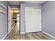 The bedroom has wood-look floors, white closet doors, and is freshly painted at 6425 Nassau Ct, Highlands Ranch, CO 80130