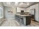 Bright kitchen featuring stainless steel appliances, granite countertops, and skylights at 6425 Nassau Ct, Highlands Ranch, CO 80130