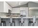 Bright kitchen featuring stainless steel appliances, granite countertops, and skylights at 6425 Nassau Ct, Highlands Ranch, CO 80130