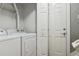 Washer and dryer hookups with storage in laundry area near closet at 6425 Nassau Ct, Highlands Ranch, CO 80130