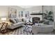 Stylish living room with fireplace, large windows, comfortable seating, and modern decor at 6425 Nassau Ct, Highlands Ranch, CO 80130