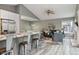 Open-concept living area featuring modern furniture, a ceiling fan, and stylish decor at 6425 Nassau Ct, Highlands Ranch, CO 80130