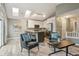 Inviting living area with a fireplace, modern furniture, and an open-concept kitchen at 6425 Nassau Ct, Highlands Ranch, CO 80130