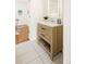 Bathroom with light wood vanity, white countertop, and tile floors at 3755 S Sherman St, Englewood, CO 80113