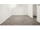 Clean and bright bedroom offers neutral carpet and white walls at 3755 S Sherman St, Englewood, CO 80113