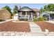 Charming single-Gathering home featuring a quaint front porch and well-maintained landscaped yard at 3755 S Sherman St, Englewood, CO 80113