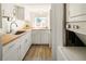 Bright kitchen with light cabinets, wooden counters and stainless steel sink at 3755 S Sherman St, Englewood, CO 80113