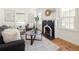 Inviting living room with natural light, a decorative fireplace, and stylish furniture at 3755 S Sherman St, Englewood, CO 80113