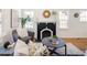 Bright living room showcasing a cozy sitting area with modern decor and a decorative fireplace at 3755 S Sherman St, Englewood, CO 80113