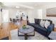 Open-concept living space with views of the kitchen, dining area, and stylish furnishings at 3755 S Sherman St, Englewood, CO 80113