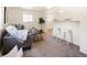 Cozy living room with neutral carpet, couch and bar seating at 3755 S Sherman St, Englewood, CO 80113