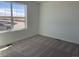 Bright bedroom featuring plush carpeting, natural light, and neutral walls at 3911 N Shawnee St, Aurora, CO 80019