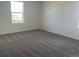 Bedroom with plush carpeting and bright natural light at 3911 N Shawnee St, Aurora, CO 80019