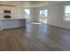 Living room features hardwood floors, stainless steel appliances, and big windows at 3911 N Shawnee St, Aurora, CO 80019