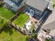 Aerial view of fenced backyard featuring a fire pit, deck, and green lawn at 1181 W 170 Th Ave, Broomfield, CO 80023