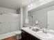 Bathroom featuring double sinks, modern fixtures, and a glass-enclosed shower at 1181 W 170 Th Ave, Broomfield, CO 80023