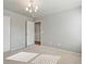 Bedroom features neutral carpet, an open doorway, and a closet with sliding doors at 1181 W 170 Th Ave, Broomfield, CO 80023