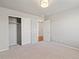 A bedroom features neutral carpet, white walls, and a closet with sliding doors at 1181 W 170 Th Ave, Broomfield, CO 80023