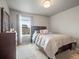Bedroom with a queen bed, dresser, rug, and window providing natural light at 1181 W 170 Th Ave, Broomfield, CO 80023
