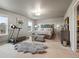 Spacious primary bedroom featuring a large bed, treadmill, and ample natural light at 1181 W 170 Th Ave, Broomfield, CO 80023