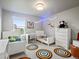 bedroom featuring twin beds, a desk and a window at 1181 W 170 Th Ave, Broomfield, CO 80023