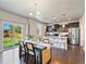 Dining area with table, chairs, pendant light, and a sliding glass door to the backyard at 1181 W 170 Th Ave, Broomfield, CO 80023