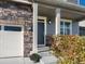Charming front entrance featuring stone accents, a covered porch, and a well-maintained garden at 1181 W 170 Th Ave, Broomfield, CO 80023