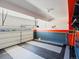 Clean and organized garage with a gray, white, and orange color scheme and plenty of open space at 1181 W 170 Th Ave, Broomfield, CO 80023