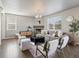 Comfortable living room with a gray sofa, fireplace, and natural light at 1181 W 170 Th Ave, Broomfield, CO 80023