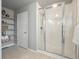 Bright bathroom featuring a glass enclosed shower with a built-in shower head and shelves at 1181 W 170 Th Ave, Broomfield, CO 80023