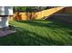 Neatly landscaped backyard with green grass at 16506 E Wesley Ave, Aurora, CO 80013