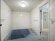 The bathroom features blue tile flooring and a large tub perfect for soaking after a long day at 8233 W 62Nd Pl, Arvada, CO 80004