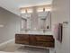Bathroom featuring a double vanity with contemporary lighting and stylish decor at 8233 W 62Nd Pl, Arvada, CO 80004