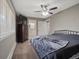 Comfortable bedroom with ceiling fan, tv, and ensuite bathroom access at 8233 W 62Nd Pl, Arvada, CO 80004