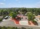 An elevated daytime view shows the beautiful landscaping surrounding this property at 8233 W 62Nd Pl, Arvada, CO 80004