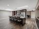 This kitchen features an island with bar seating, wood floors, and stainless steel appliances at 8233 W 62Nd Pl, Arvada, CO 80004