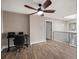 Office area with wood flooring, natural light, and a modern desk setup at 8233 W 62Nd Pl, Arvada, CO 80004